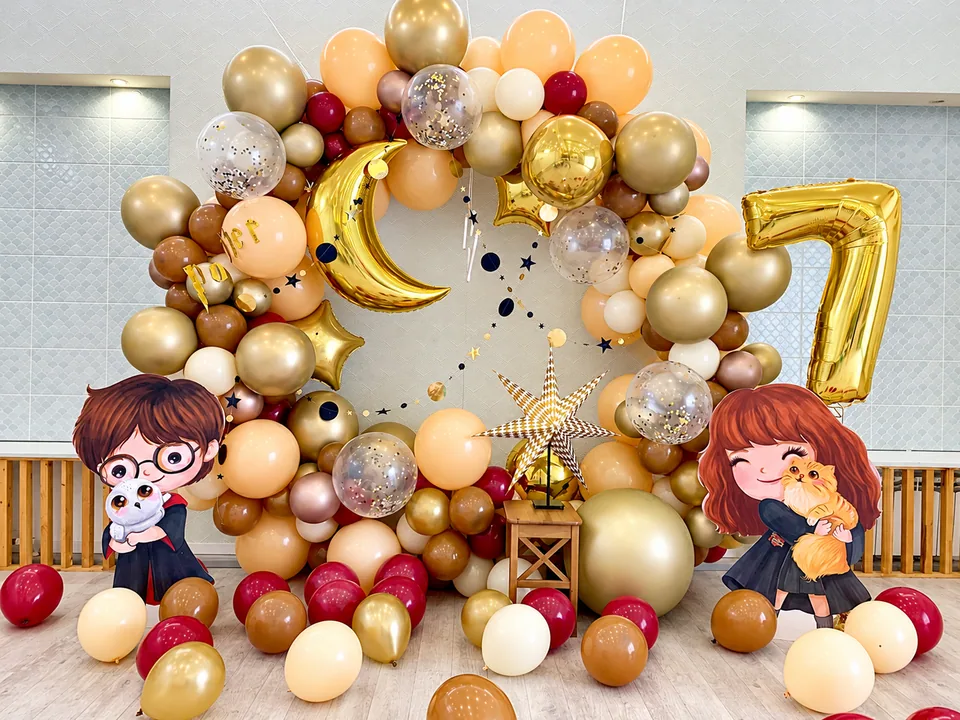 Gold, cream and burgundy wizard birthday balloon ring with moon and character standees