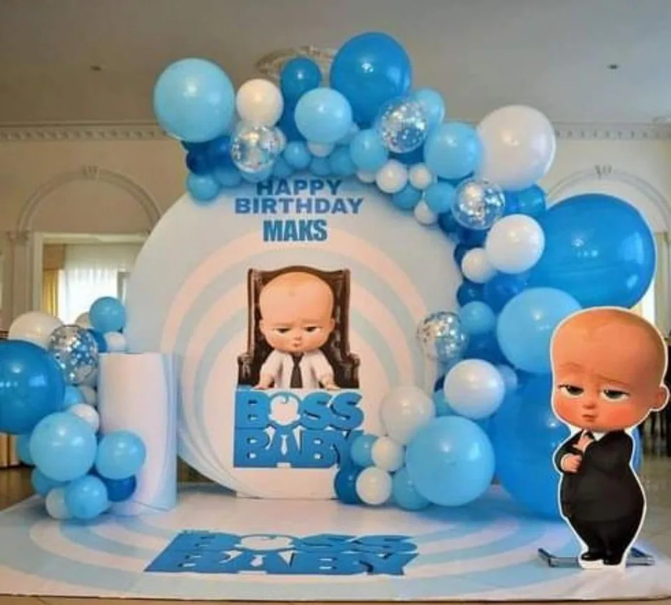 Blue and white Boss Baby birthday backdrop with character standees