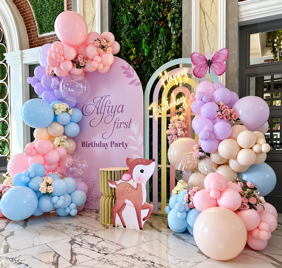 Pastel balloon backdrop inspiration with flowers and woodland details